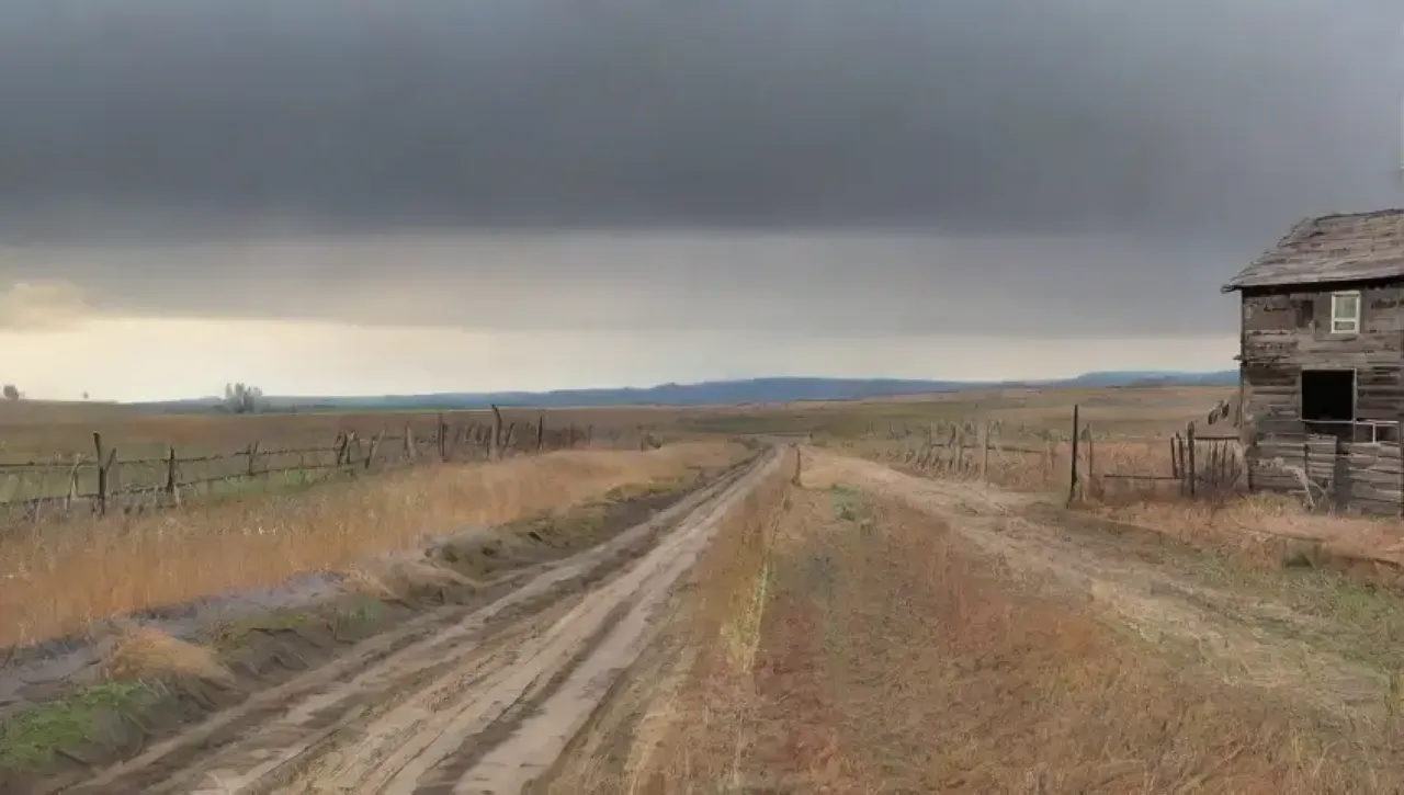 Un paisaje rural desolado con tierra agrietada, cultivos marchitos y herramientas oxidadas, pero con destellos de esperanza