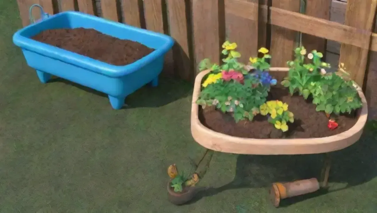 Un jardín vibrante y sereno lleno de flores, herramientas y naturaleza